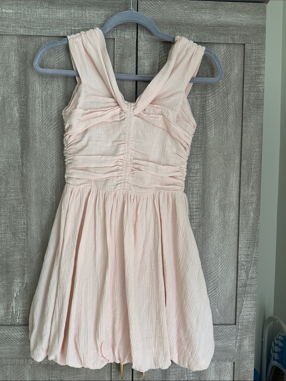 H&M Soft Pink Sleeveless Ruched Bodice mini dress with a bubble skirt.